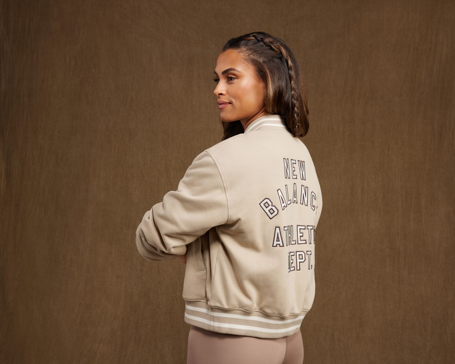 Sydney McLaughlin-Levrone models a New Balance jacket.